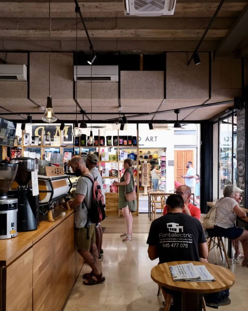 Busy coffee bar inside Arabay's flagship café on Carrer del Sindicat in Palma