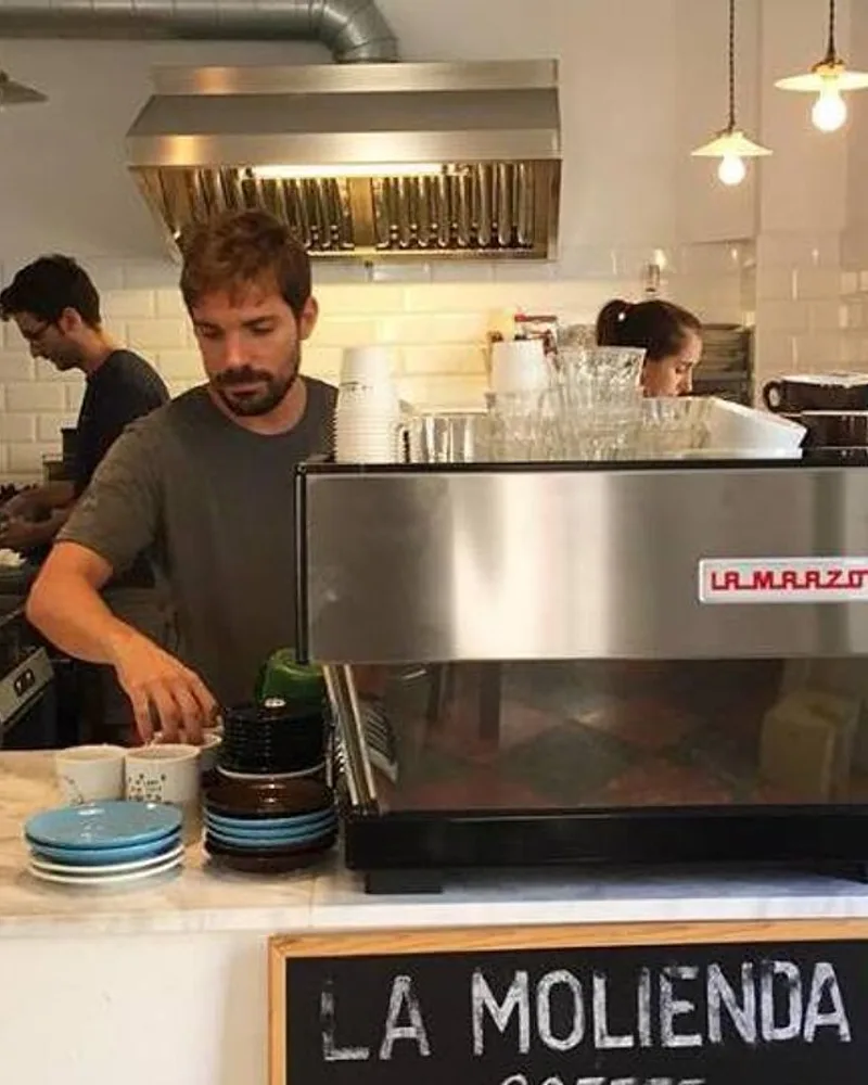 Baristas working behind the espresso counter at La Molienda in Palma