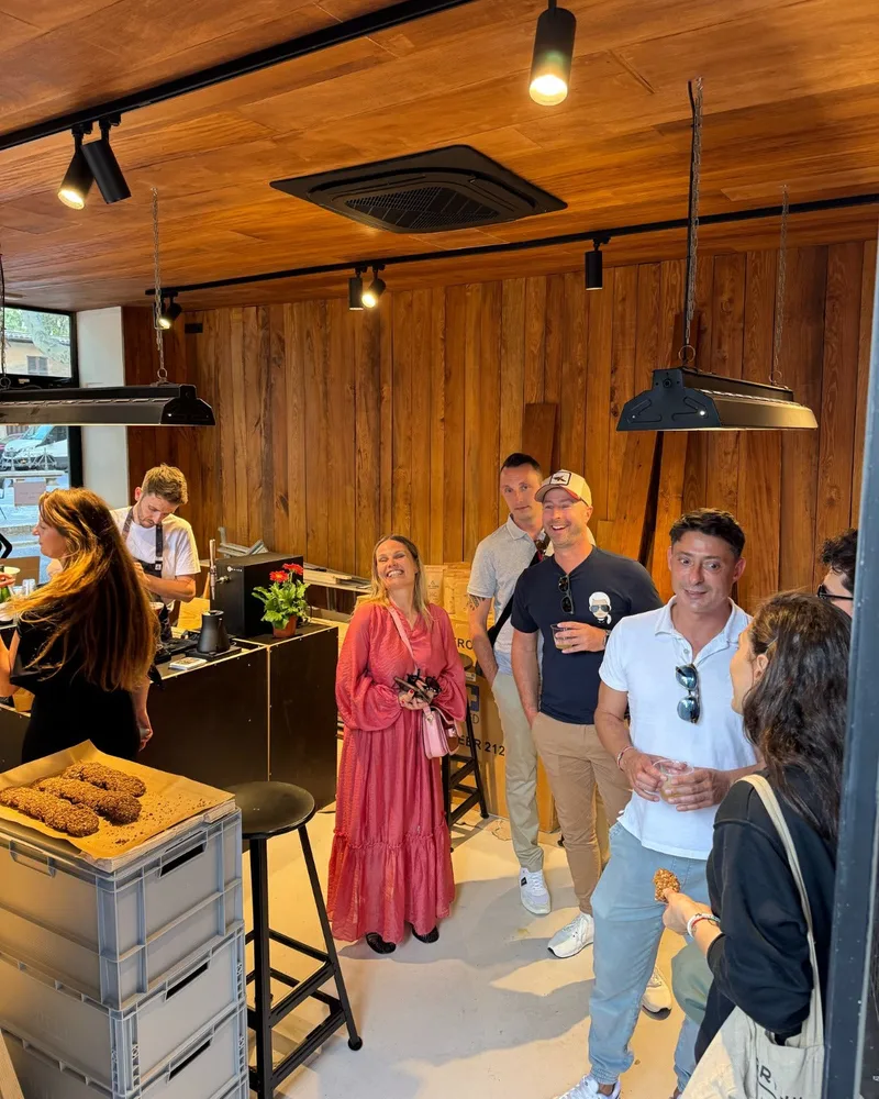 Customers gathered around the wooden counter at The Barn La Rambla in Palma